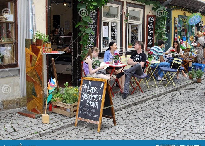 Merchants Bridge People are Chilling on a Terrace at the Famous Merchants Bridge in ... photo