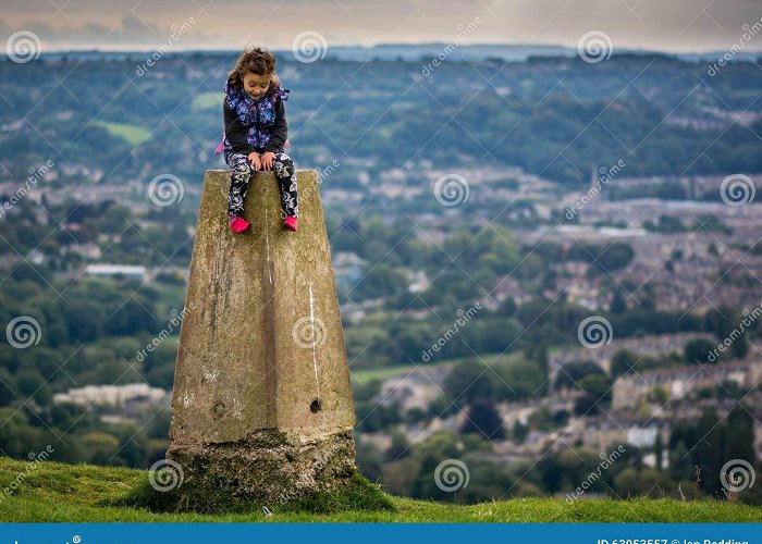 Little Solsbury Hill Young Girl Sitting on Triangulation Point on Little Solsbury Hill ... photo