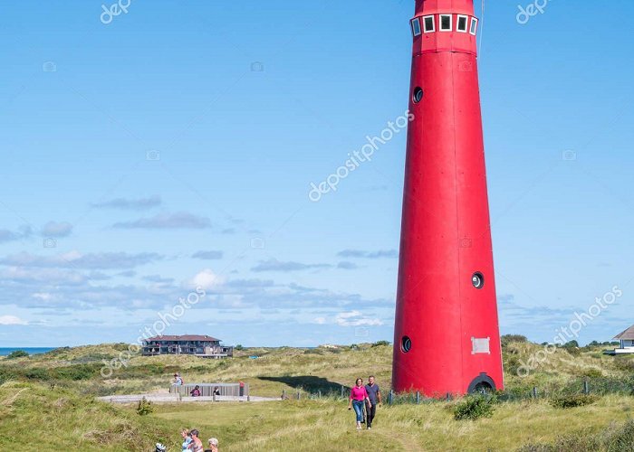 Nothern Lighthouse People and lighthouse North Tower in dunes of Frisian island Sch ... photo