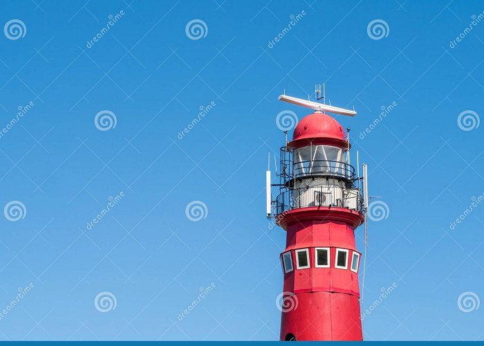 Nothern Lighthouse Top of Red North Tower Lighthouse Against Blue Sky, Frisian Island ... photo