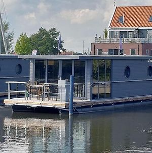 Modern house boat in Volendam with jetty Hotel Exterior photo